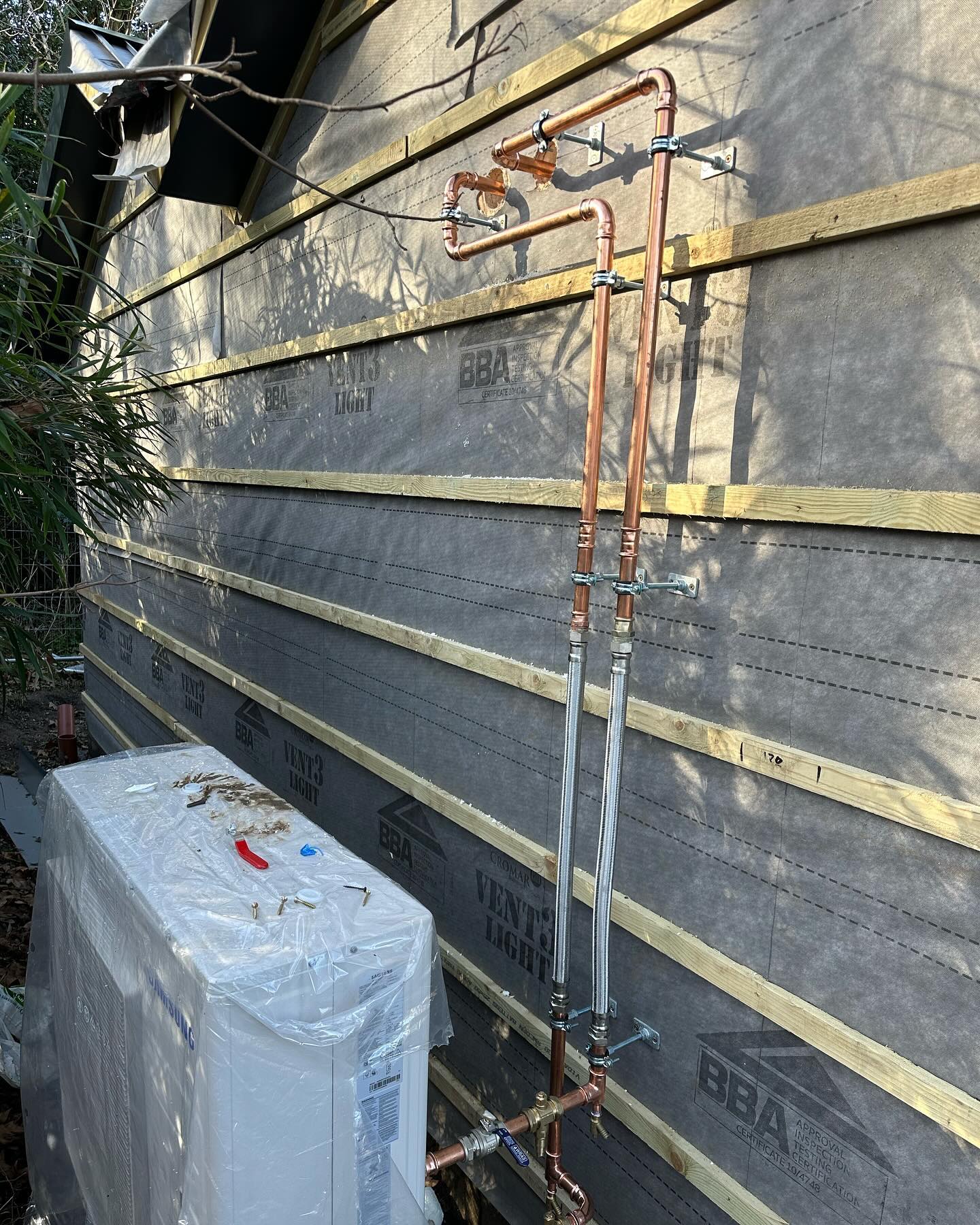 Copper pipework and air source heat pump installation